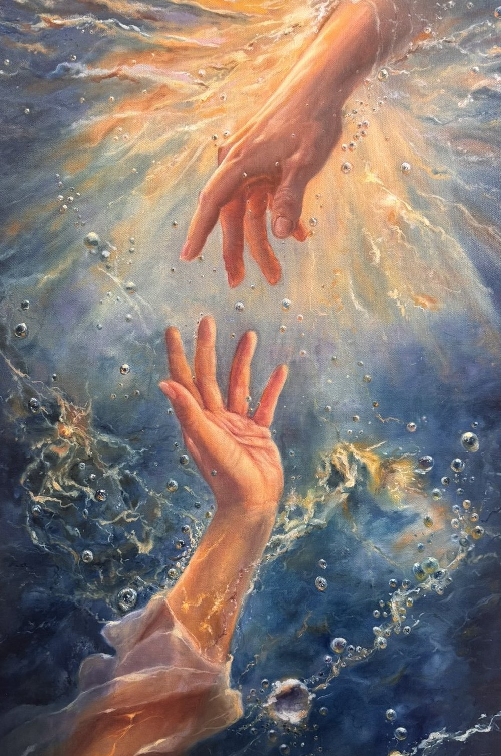 Two hands reaching toward each other through sunlit water