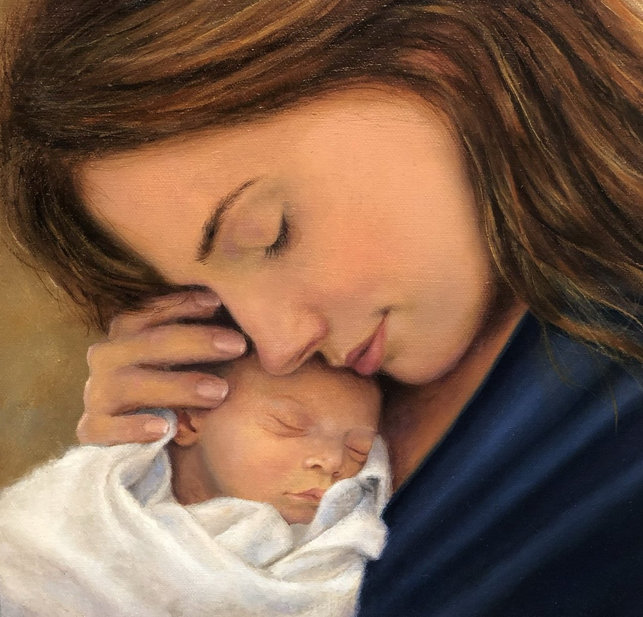 Mother cradling a sleeping newborn