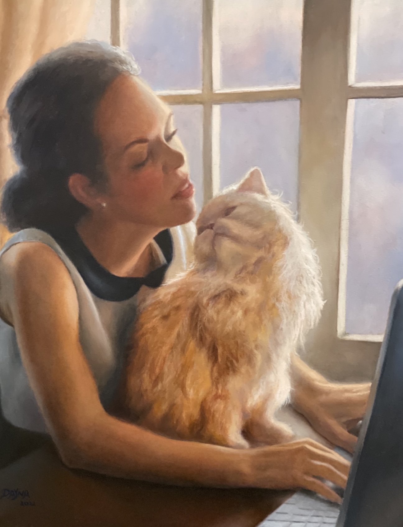 Woman at a sunlit window holding a long-haired cat